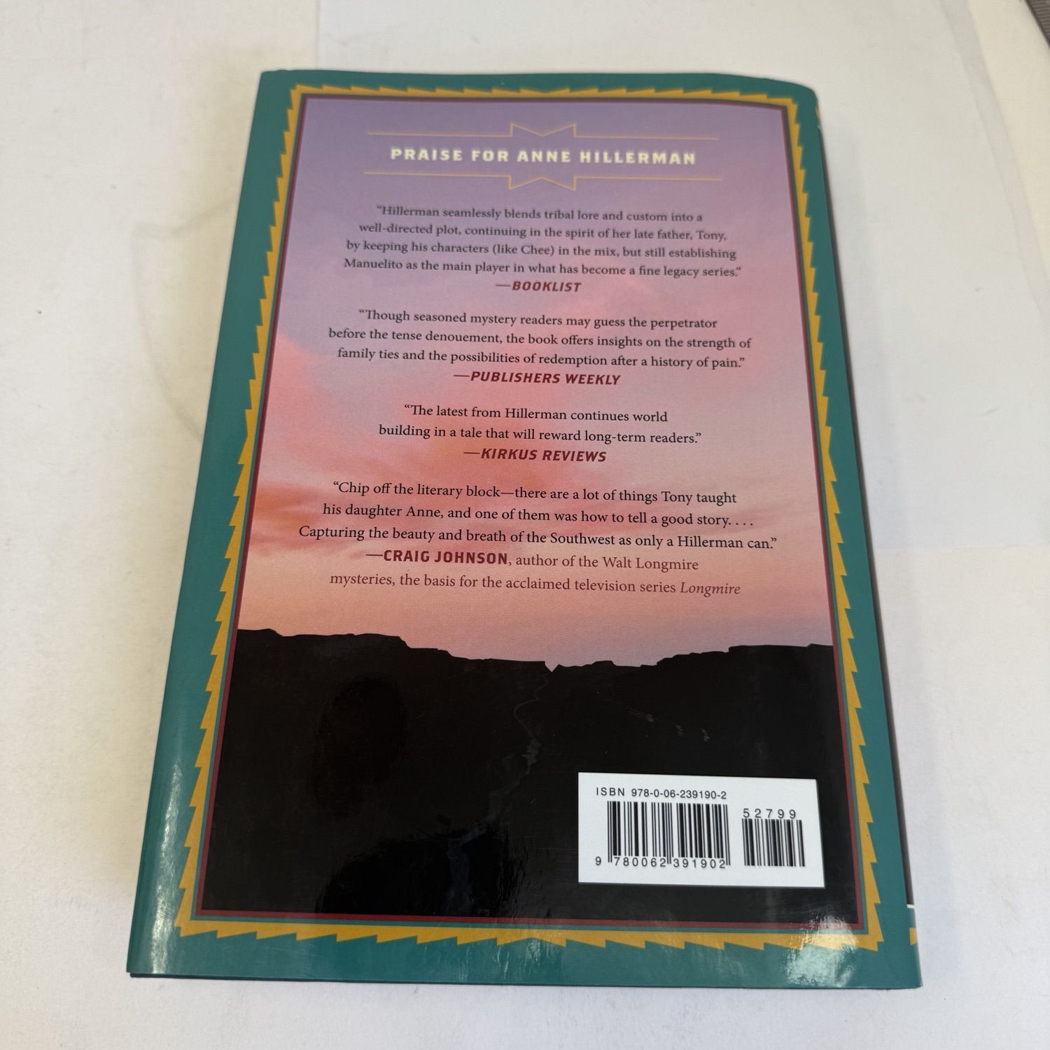 Back cover of Song of the Lion first edition showing praise quotes from Booklist, Publishers Weekly, Kirkus Reviews, and Craig Johnson (author of the Walt Longmire mysteries), with ISBN barcode