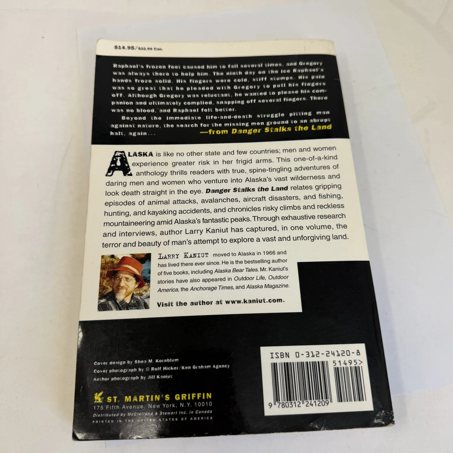 Back cover of Danger Stalks the Land by Larry Kaniut showing author biography, Spike Walker blurb calling Kaniut a heart after Alaska and a nose for wilderness adventure, and St. Martin's Griffin imprint. First edition November 1999.