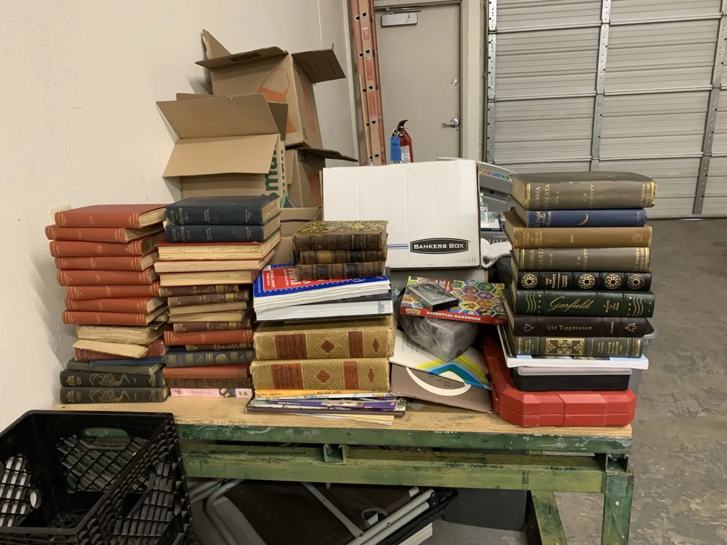 Estate book donation arriving at the New Mexico Literacy Project warehouse in Albuquerque's North Valley — boxes staged for hand-sorting