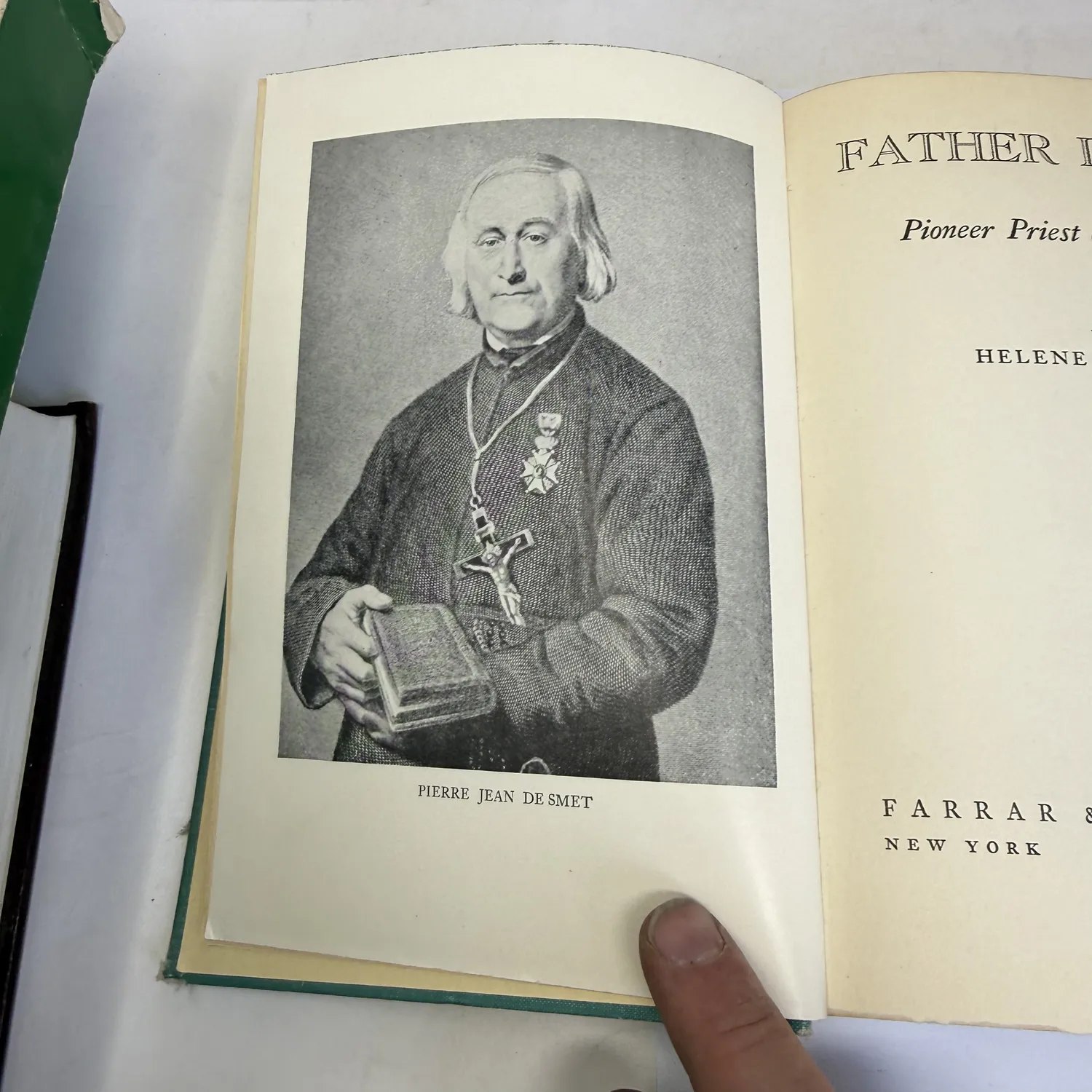 Close-up of the frontispiece portrait engraving of Pierre Jean De Smet from Father De Smet by Helene Magaret, showing the Jesuit missionary in clerical robes wearing medals including a cross and holding a small book. Farrar and Rinehart 1940.