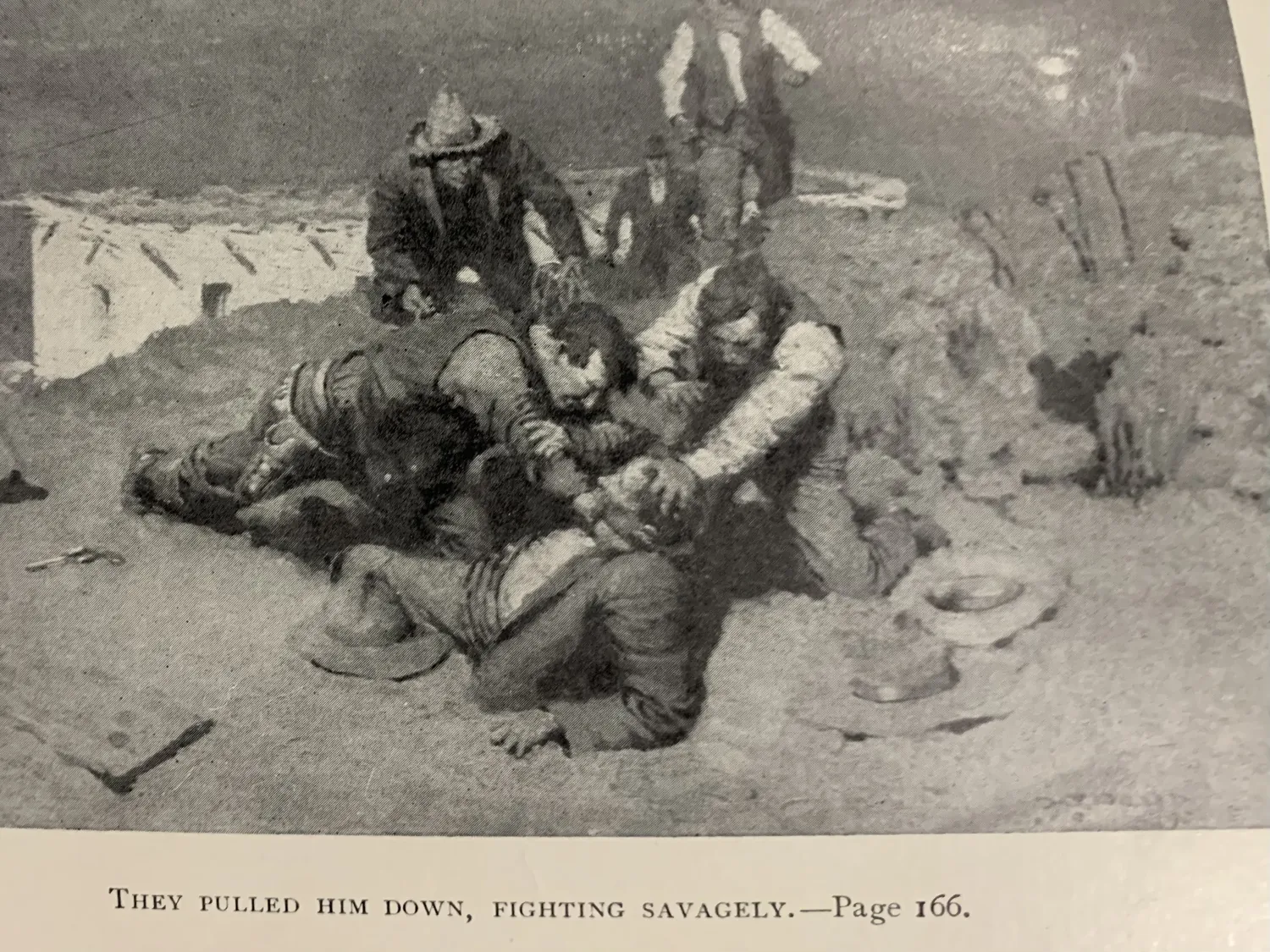 Interior illustration by H. T. Dunn from Good Men and True by Eugene Manlove Rhodes Henry Holt 1910 captioned They pulled him down fighting savagely page 166 showing a brawl scene in the New Mexico range country