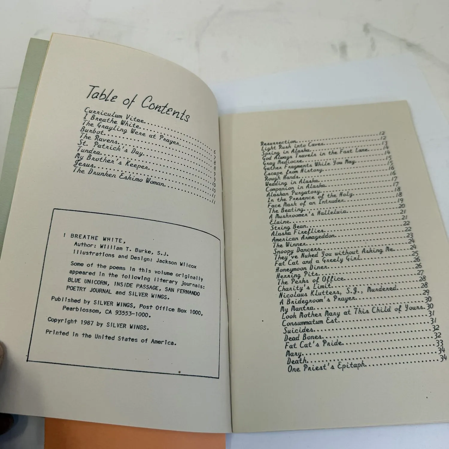 Table of contents and copyright page spread of I Breathe White by William T. Burke S.J., showing poem titles and Silver Wings Press copyright information, 1987 Alaska Jesuit poetry chapbook with illustrations by Jackson Wilcox.