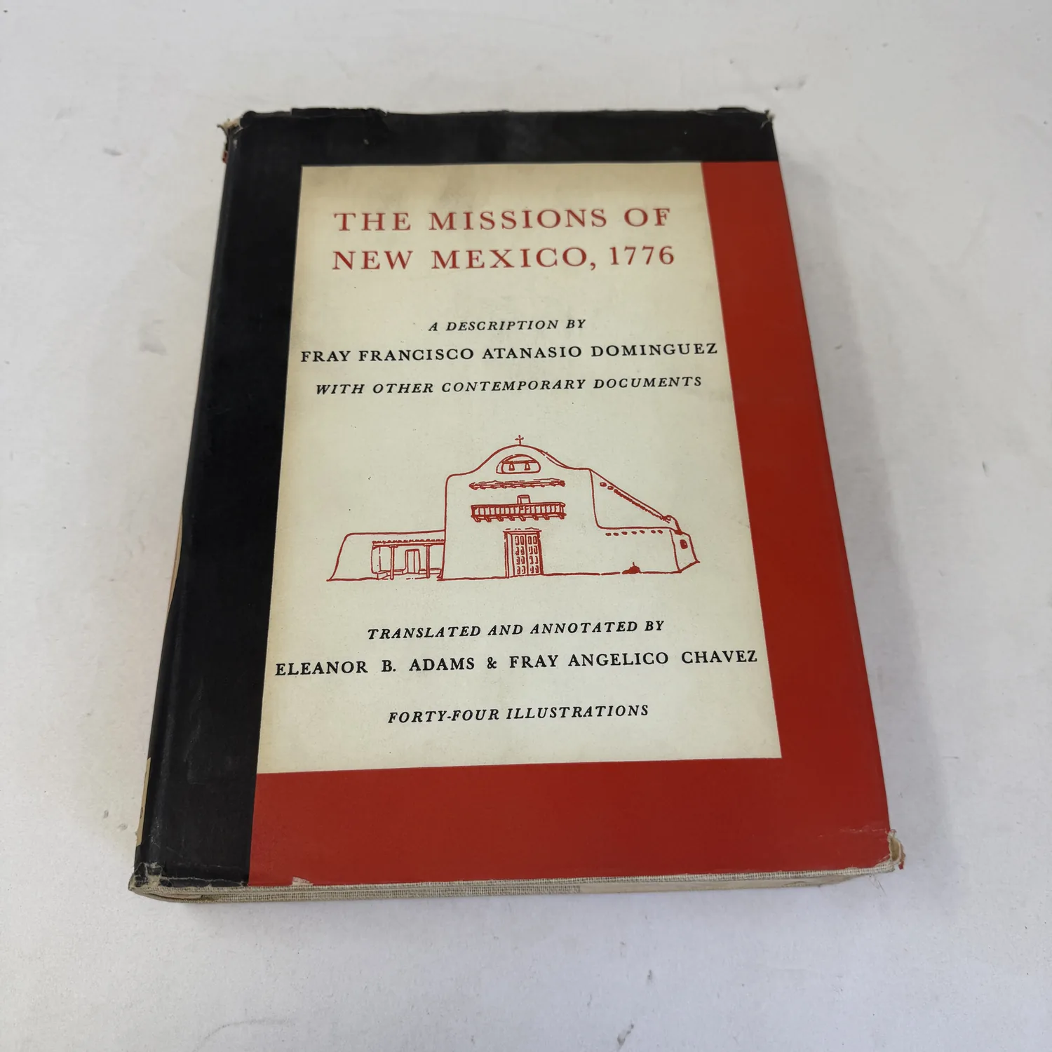 Dust jacket of The Missions of New Mexico, 1776, a description by Fray Francisco Atanasio Dominguez, translated and annotated by Eleanor B. Adams and Fray Angelico Chavez, University of New Mexico Press 1956, photographed at New Mexico Literacy Project