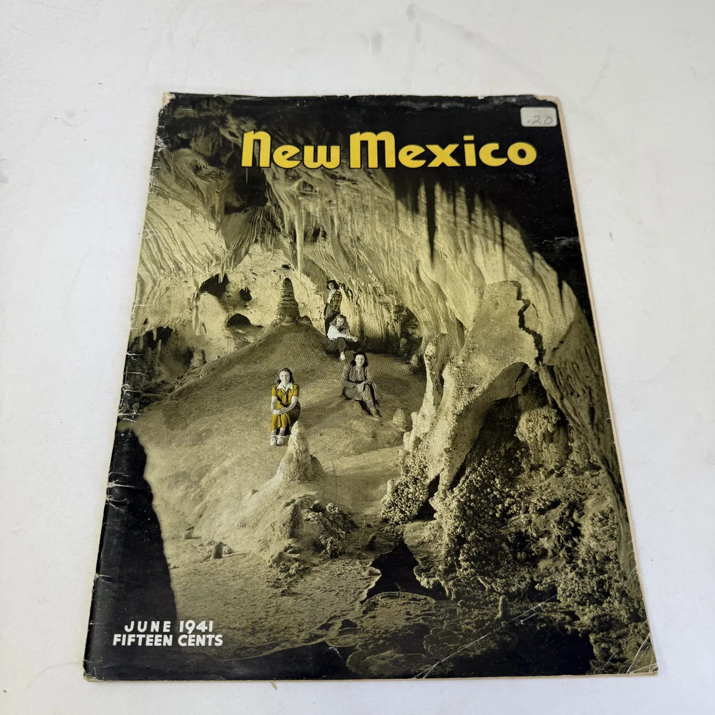 New Mexico Magazine June 1941 cover: two visitors inside Carlsbad Caverns among limestone formations — photographed at New Mexico Literacy Project