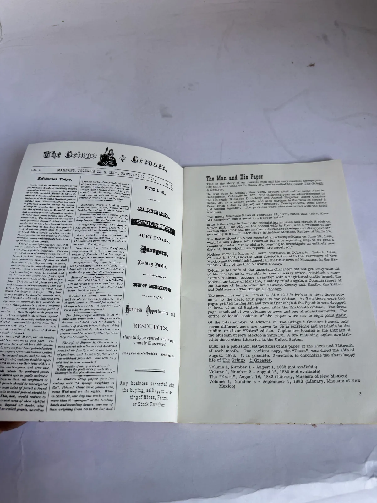Interior spread of a Press of the Territorian pamphlet reproducing a territorial New Mexico newspaper front page, photographed at New Mexico Literacy Project