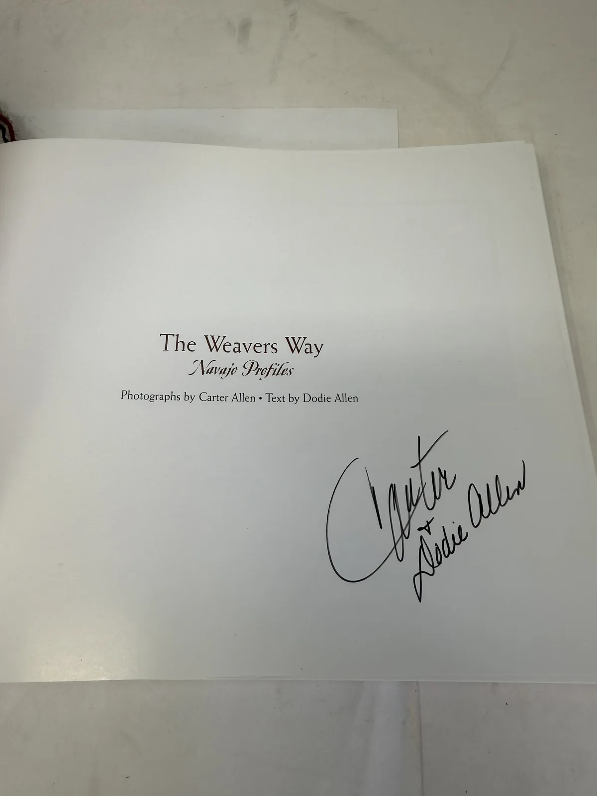 Title page of The Weavers Way Navajo Profiles, photographs by Carter Allen and text by Dodie Allen, signed in ink by both, photographed at New Mexico Literacy Project